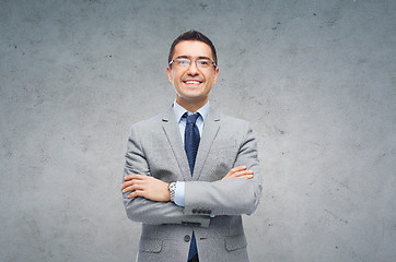 Image showing happy smiling businessman in eyeglasses and suit