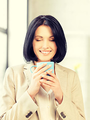 Image showing lovely businesswoman with mug