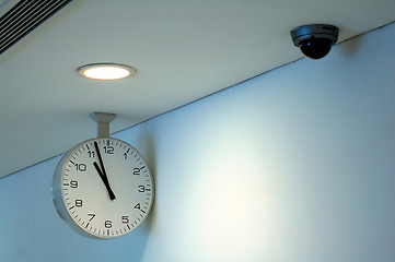 Image showing Clock and security camera