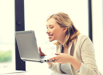 Image showing happy woman with laptop computer