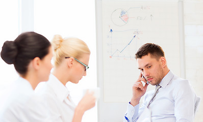 Image showing stressed male boss on business meeting