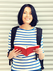 Image showing woman with bag and book