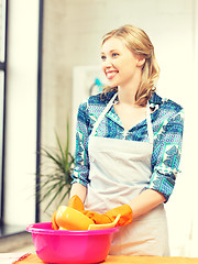 Image showing housewife washing dish at the kitchen