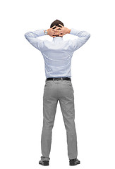 Image showing businessman with hands behind his head from back