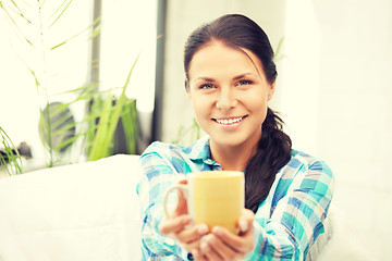 Image showing lovely housewife with mug