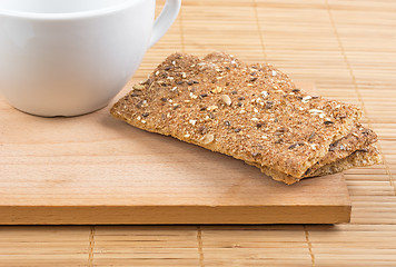 Image showing Crispbread and a fragment of a white cup.