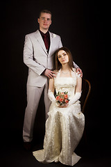 Image showing Wedding photo. Young beautiful couple on a black background.