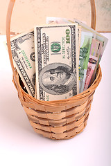 Image showing money set in a basket, dollars, euro