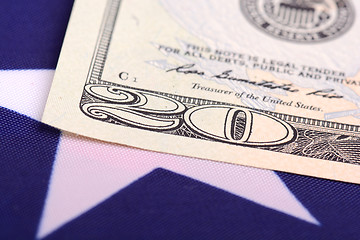 Image showing dollars on american flag