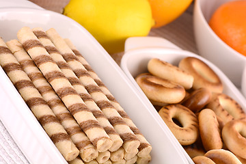 Image showing sweet cake on white plate with lemon