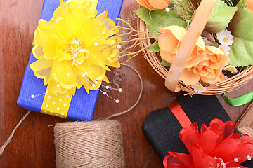 Image showing gift box, flowers and old thread