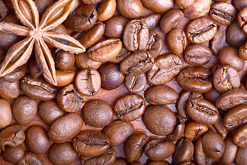 Image showing Chocolate muffin, coffee beans, cinnamon, star anise on sacking background.