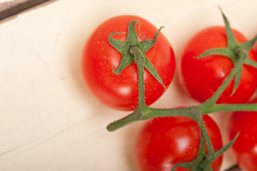 Image showing fresh cherry tomatoes on a cluster