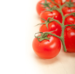 Image showing fresh cherry tomatoes on a cluster