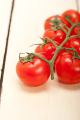Image showing fresh cherry tomatoes on a cluster