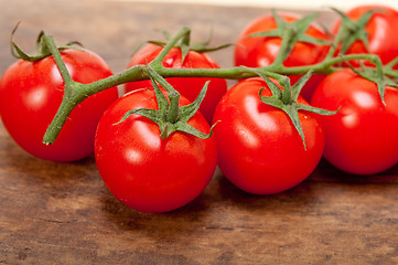 Image showing fresh cherry tomatoes on a cluster