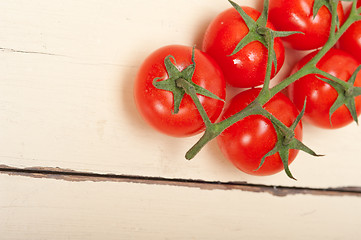 Image showing fresh cherry tomatoes on a cluster