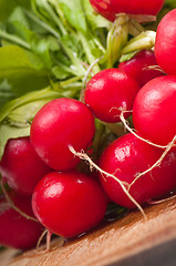 Image showing Radishes on wooden background