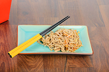 Image showing Meat and noodles in red take away container