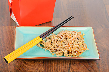 Image showing Meat and noodles in red take away container