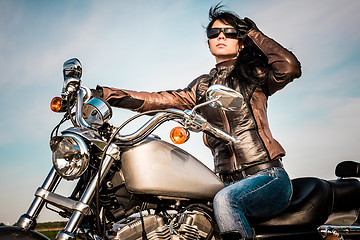 Image showing Biker girl on a motorcycle