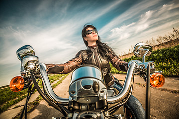 Image showing Biker girl on a motorcycle