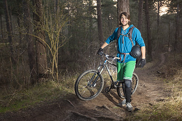 Image showing Young man with his ATB in the forest