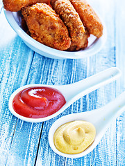 Image showing sauce and chicken wings