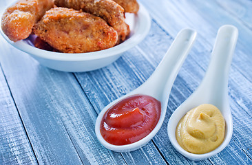 Image showing sauce and chicken wings