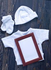 Image showing baby clothes on a table