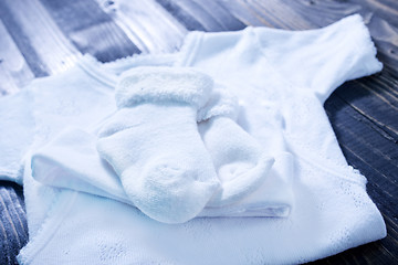 Image showing baby clothes on a table