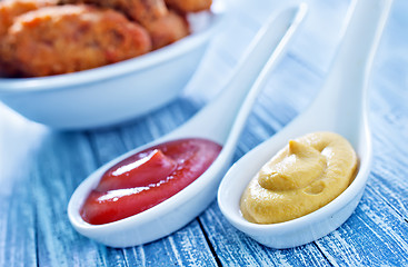 Image showing sauce and chicken wings