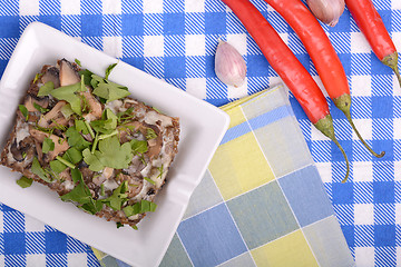 Image showing mushroom salad and red pepper on white plate