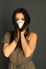 Image showing Attractive woman with protective mask