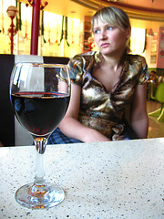 Image showing the girl with glass of red wine in restaurant