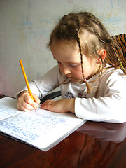 Image showing the girl learning her  home tasks