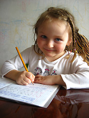 Image showing the girl learning her  home tasks