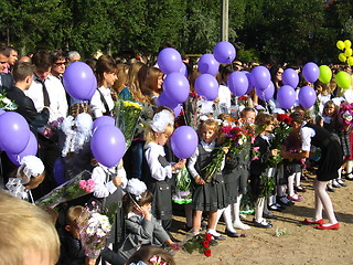 Image showing children with flowers and balloons on a holiday of the 1st september