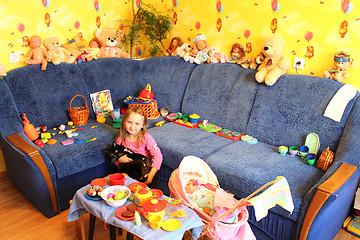 Image showing little girl playing with toys in her room