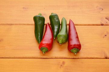 Image showing Five red and green hot chilis