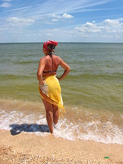 Image showing girl standing at the seacoast