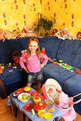 Image showing little girl playing with toys in her room