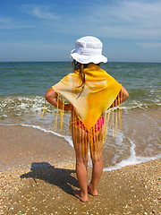 Image showing girl standing at the seacoast