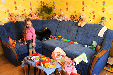 Image showing little girl playing with toys in her room