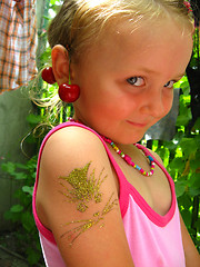 Image showing girl felt embarrassed with unusual ear-ring