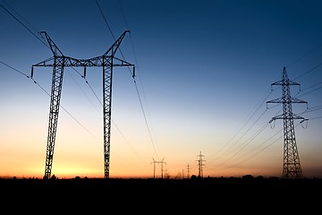 Image showing Large transmission towers at blue hour 