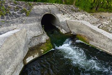 Image showing Cooling water flowing into the river