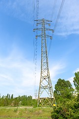 Image showing Large electric pylon with blue sky