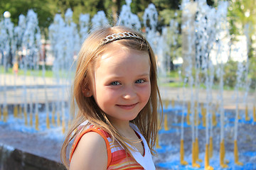 Image showing little sympathetic girl near fountains