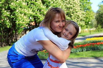 Image showing mother and daughter embrace